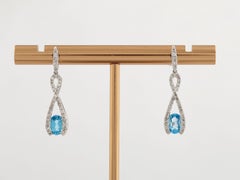 14K White Gold Blue Topaz and Diamond Infinity Drop Earring