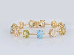 Pulsera tipo «tenis» de plata de ley 925 con varias piedras preciosas de 26,26 quilates, de corte ovalado y chapada en oro