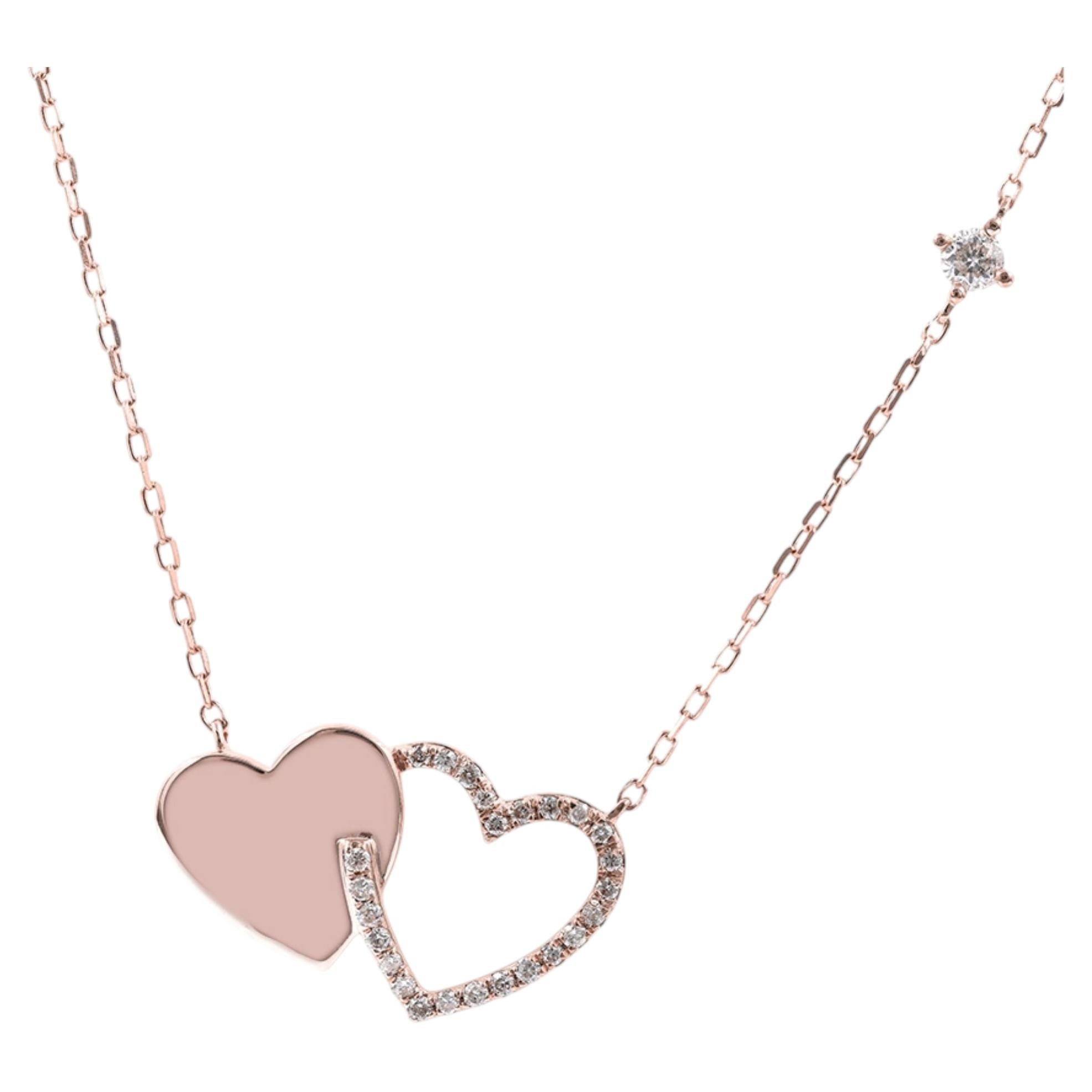 Collana con ciondolo a forma di due cuori intrecciati in oro rosa 14 carati con diamanti