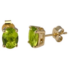 14K Yellow Gold Oval Peridot 2.41 Cts Stud Earrings