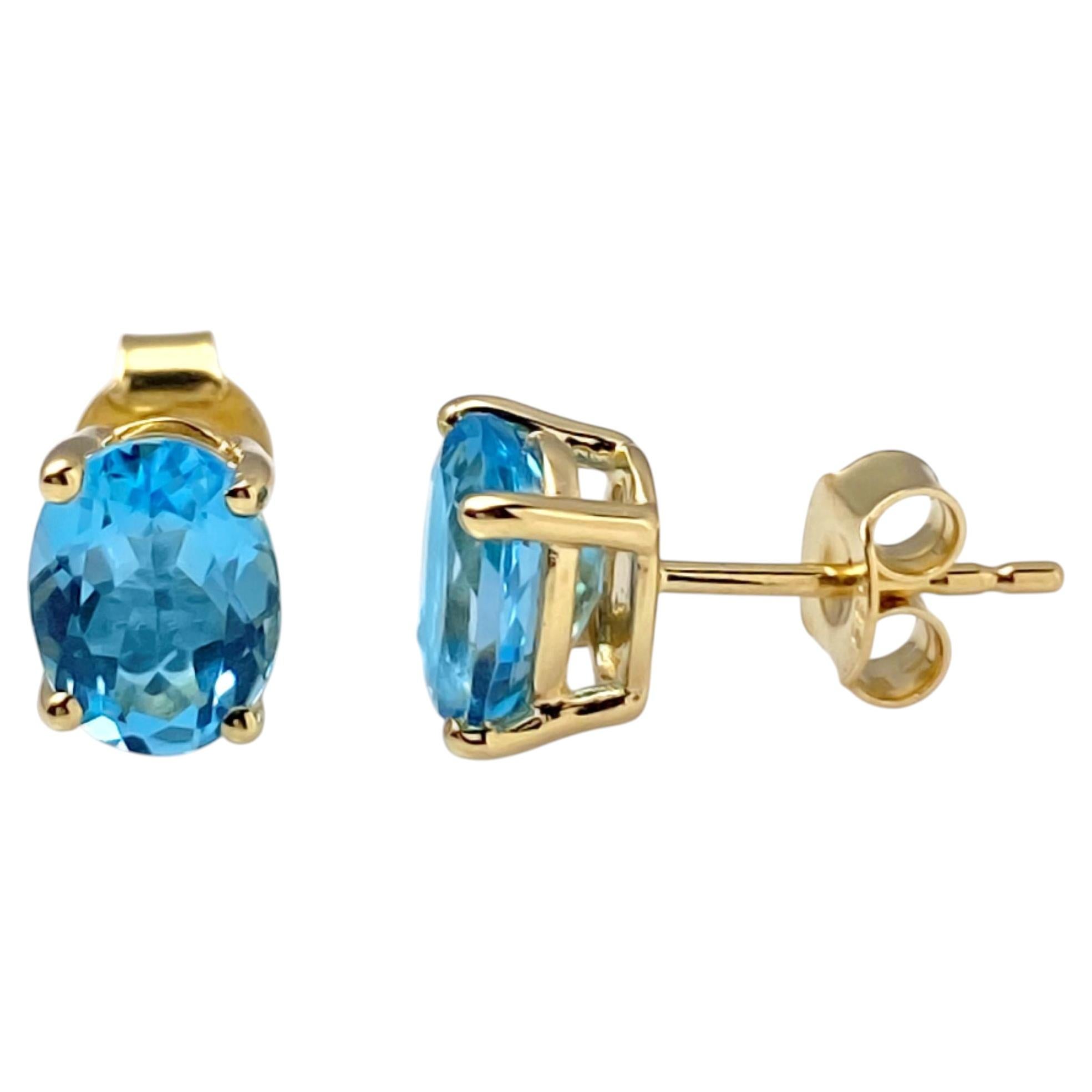 14K Yellow Gold Oval Swiss Blue Topaz 2.95Cts Stud Earrings For Sale