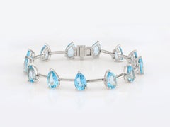 Bracelet à maillons en argent sterling 925 plaqué or, avec une topaze bleue taille poire