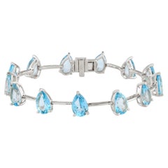Bracelet à maillons en argent sterling 925 plaqué or, avec une topaze bleue taille poire