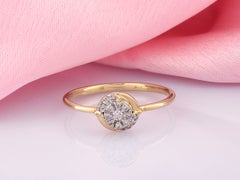 Bague en or jaune 14 carats avec diamants disposés en grappe, de forme circulaire, à monture « bypass »
