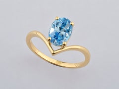 Classic 14K Yellow Gold Oval Blue Topaz V-Shaped Solitaire Gold Ring