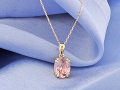 Collana con ciondolo in oro giallo 14 carati con solitario ovale in topazio rosa da 2,02 carati