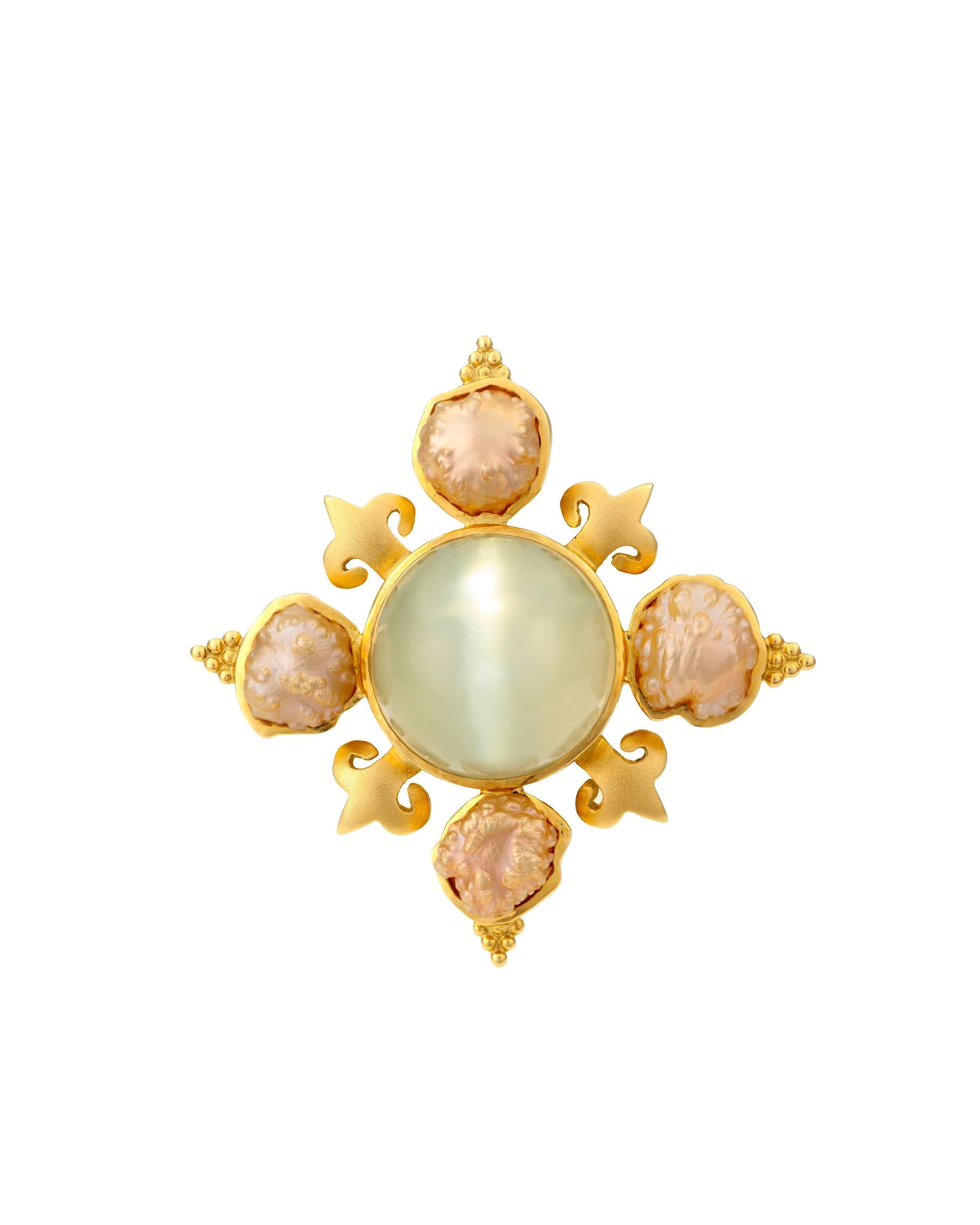 A rare Crevoshay brooch with cabochon moonstone and 4 Rosebud pearls.

Moonstone=53.82 ct. 