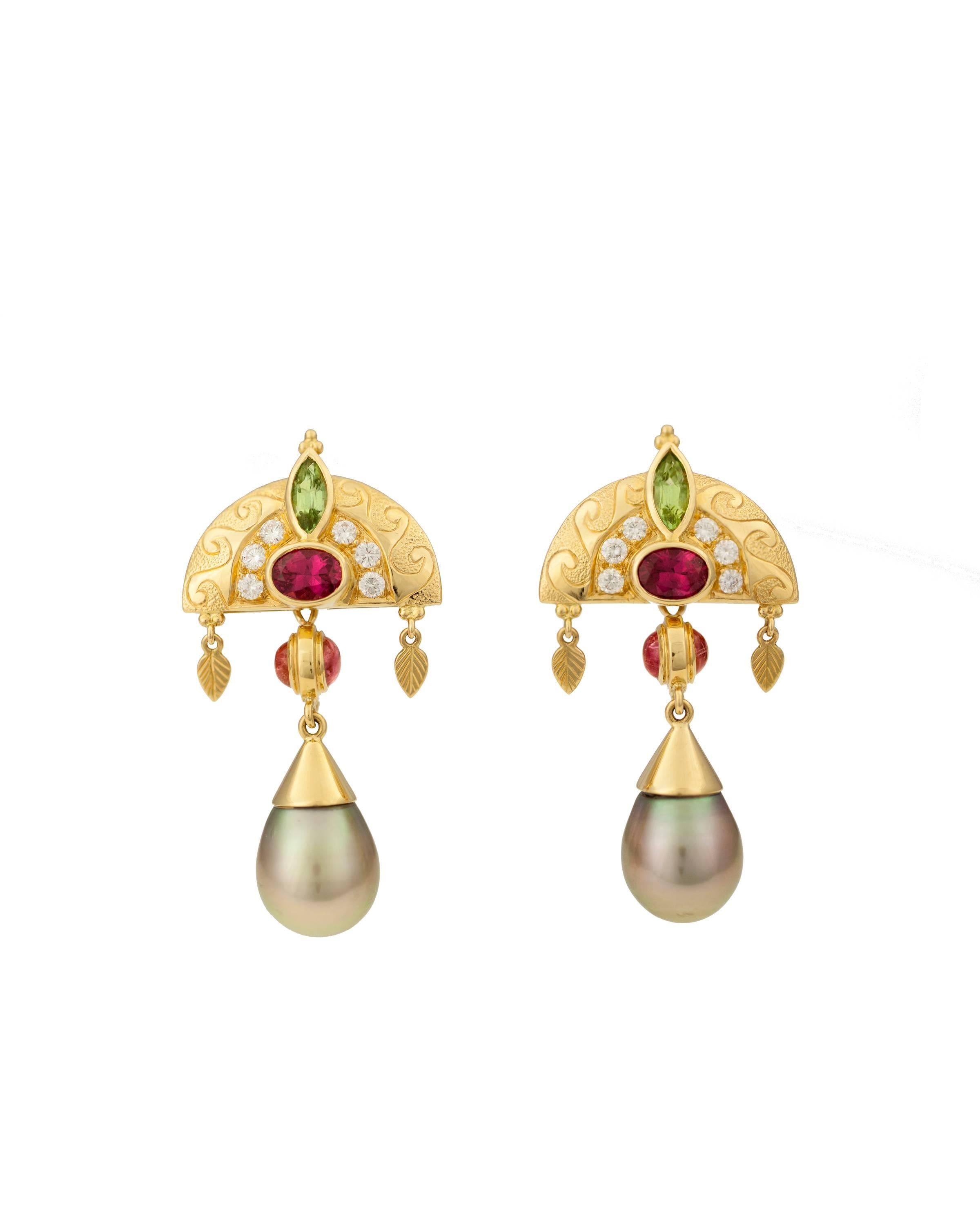 A beautiful hand made pair of Crevoshay pearl, tourmaline and diamond earrings.

Tourmaline oval = 1.45ct. 