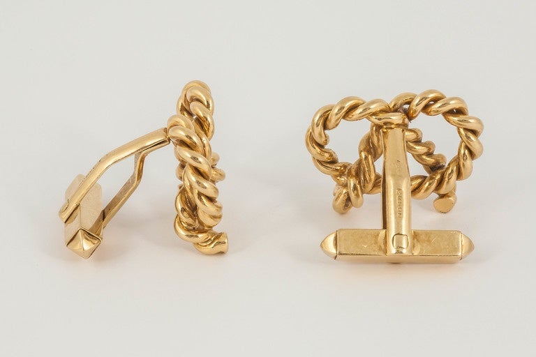 A heavy pair of 18ct gold hallmarked cufflinks signed by Kutchinsky of open,rope design