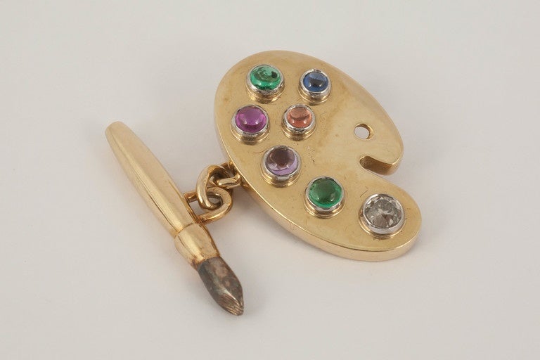 An unusual pair of natural coloured stone palette cufflinks and brush ,c1950  diamond,emerald,topaz,ruby,amethyst,marked 750 for 18ct gold and makers mark I Z [unknown]