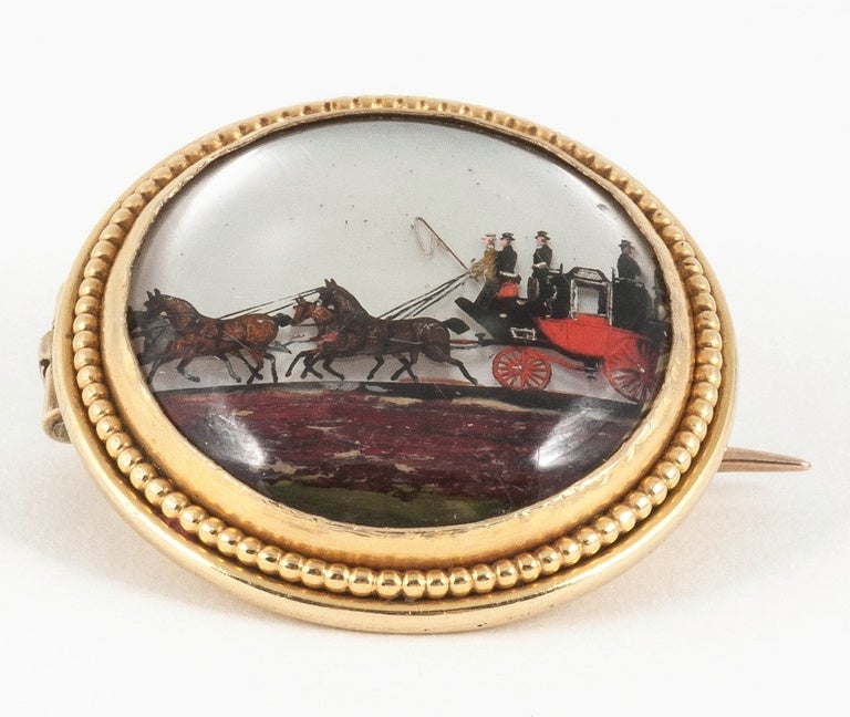Late Victorian Victorian Reverse painted crystal coach and horses brooch