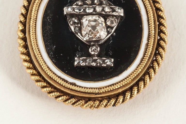 gold mounted enamel mourning pendant with a cushion cut diamond Urn centre,engraving to reverse,English c,1785