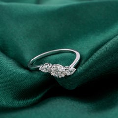 0.55 Carat Natural Pear-Accented Oval Trilogy Engagement Ring in 18K White Gold
