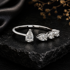 0.66 Carat Natural Graduated Pear Diamond Open Cuff Ring in 18K White Gold