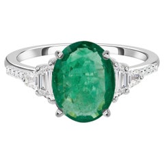 2.51 Ct Oval Zambian Emerald 0.34 Ct Diamond Three Stone Ring in 18K White Gold