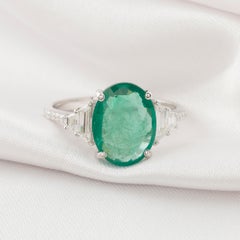 2.51 Ct Oval Zambian Emerald 0.34 Ct Diamond Three Stone Ring in 18K White Gold