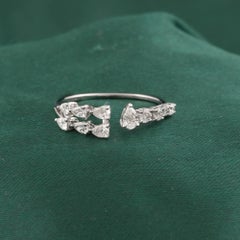 Bague « bypass » en or blanc 18 carats sertie de diamants naturels taille poire et ronde de 0,56 carat, certifiée HRD