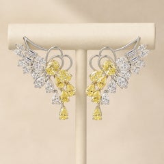 Pendientes de alas en espiral con un diamante natural de 6,73 ct en talla marquesa, de oro bicolor de 18 quilates