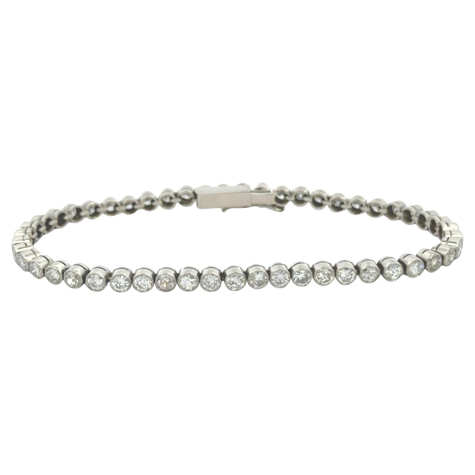 Estate Platinum Rounded Diamond Bezel Tennis Bracelet