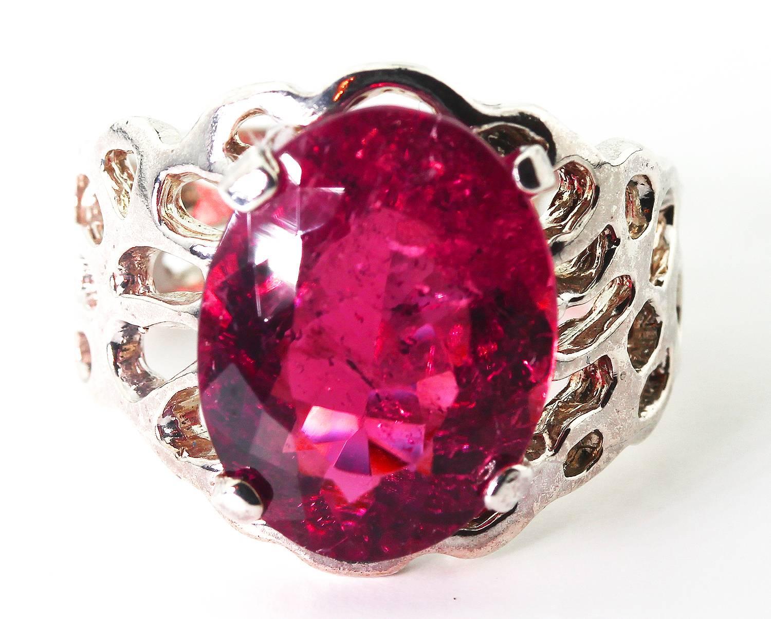 There are no chips and no easily visible inclusions in this unique magnificent pinky reddish natural 8.5 Carat Rubelite Tourmaline with natural pinky reflections inside the gemstone set in a handmade Sterling Silver ring.  Please pardon the light