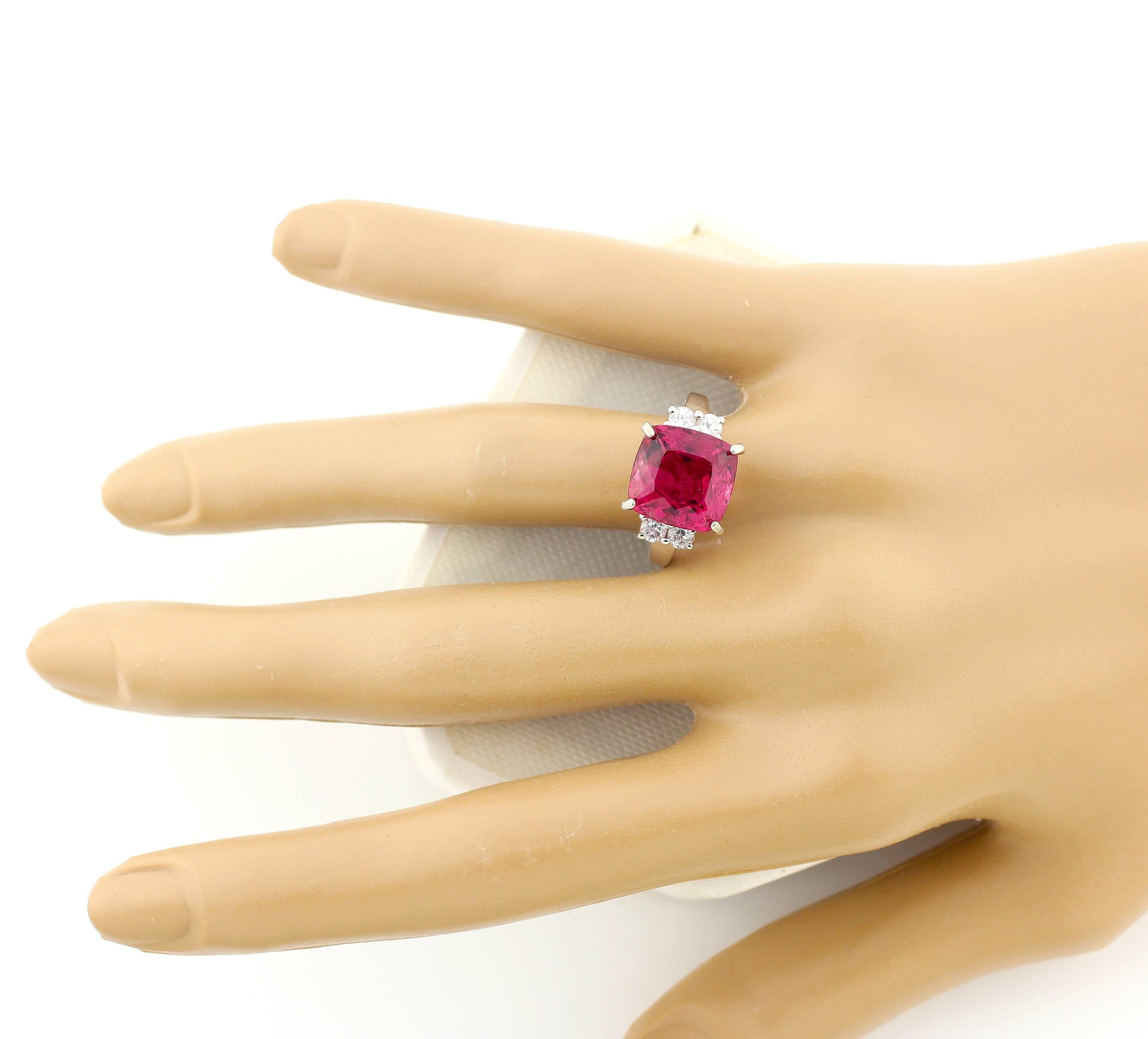 Sparkling brilliant 6.8 carat natural Brasilian Rubelite enhanced with sparkling white natural glittering Brazilian Topaz set in this unique handmade Sterling Silver ring size 7.  (the ring is sizable for free).  This is absolutely beautiful on your