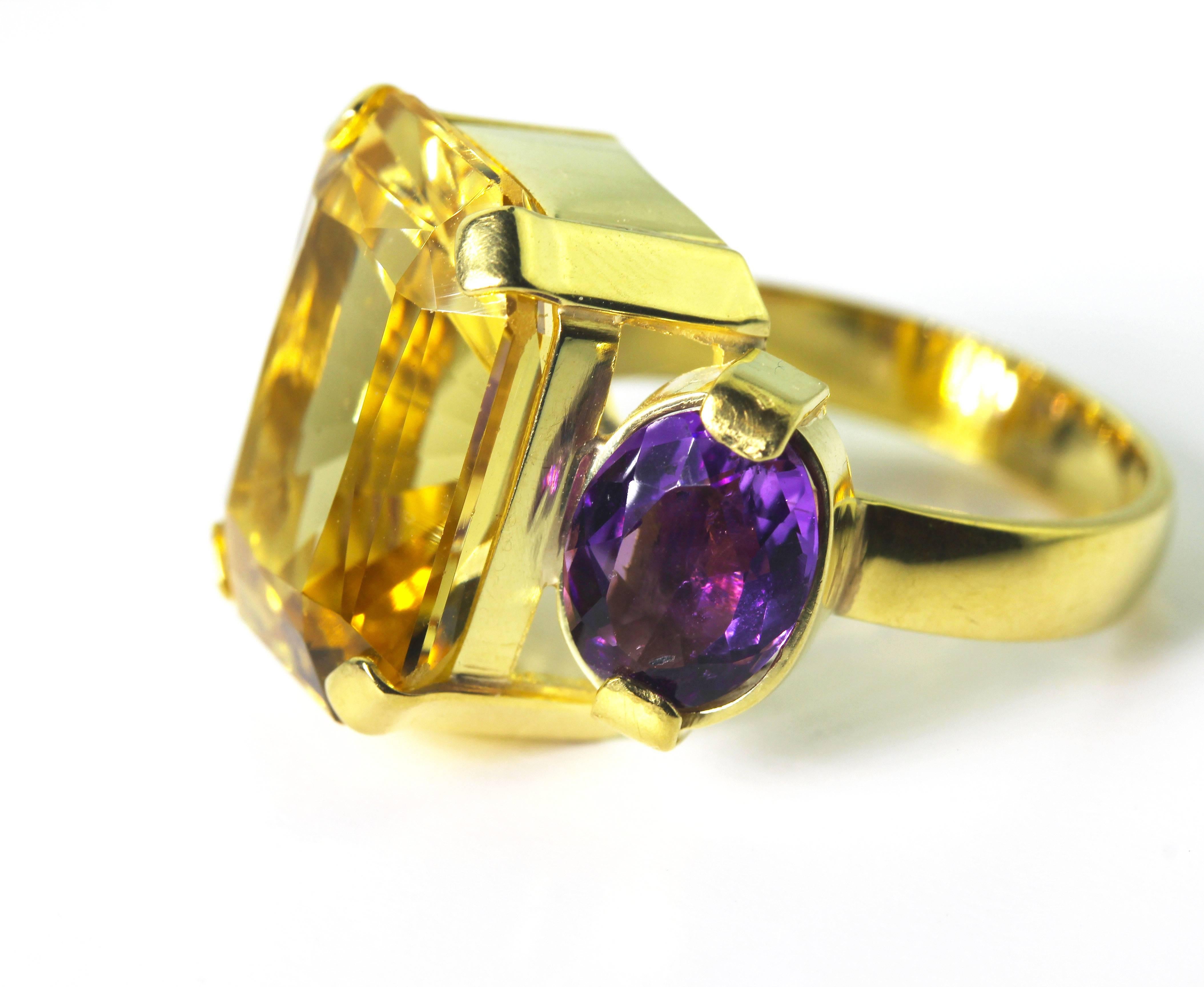 This brilliant clear gem cut huge 13.5 Carat Heliodor Beryl is enhanced with 2.6 Carats of sparkling Amethysts set in this handmade unique 18 Karat yellow gold ring size 7 (sizable).  More from this seller by putting gemjunky into 1stdibs search bar.