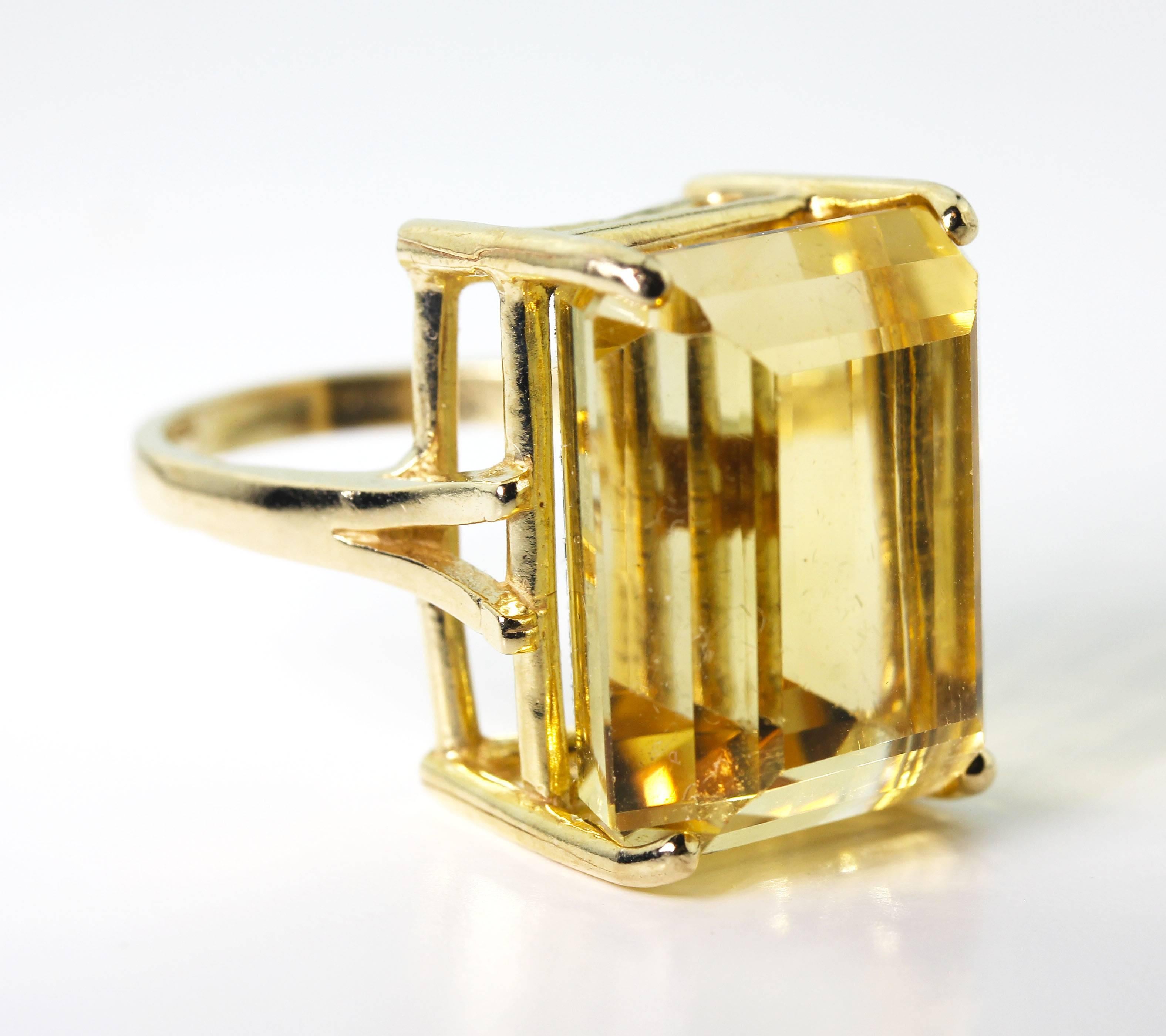 Huge glowing yellow 27 Carat (14.55 mm x 18.4 mm) natural Madagascar Citrine gold ring.  The ring is 14Kt yellow gold and is a size 7 (sizable).  Note that this is a fairly rare gemstone and its yellow color is brilliantly and splendidly different