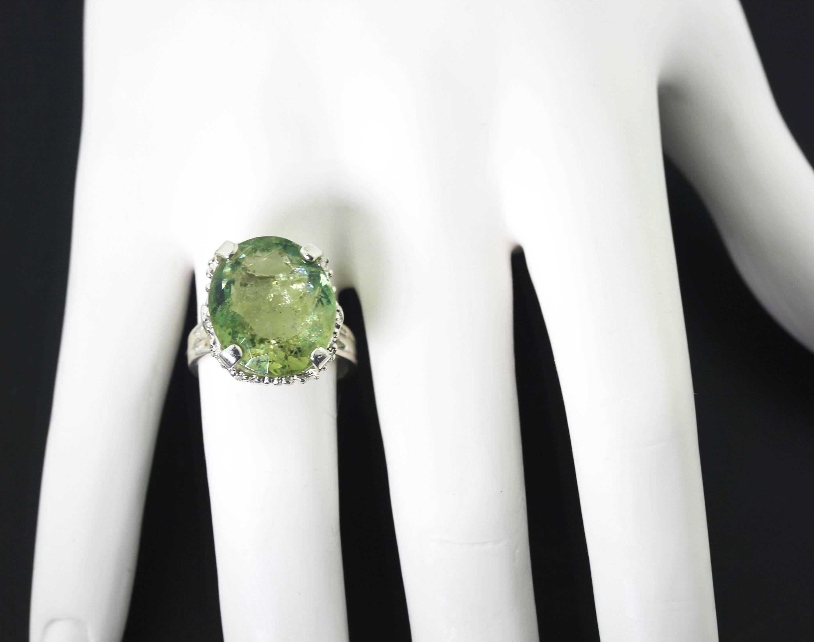 Natural Brazilian bright translucent green Tourmaline - 17.85 mm x 15.1 mm -  set in a unique handmade sterling silver ring size 8.5 (sizable).  More from this seller by putting gemjunky into 1stdibs search bar.
