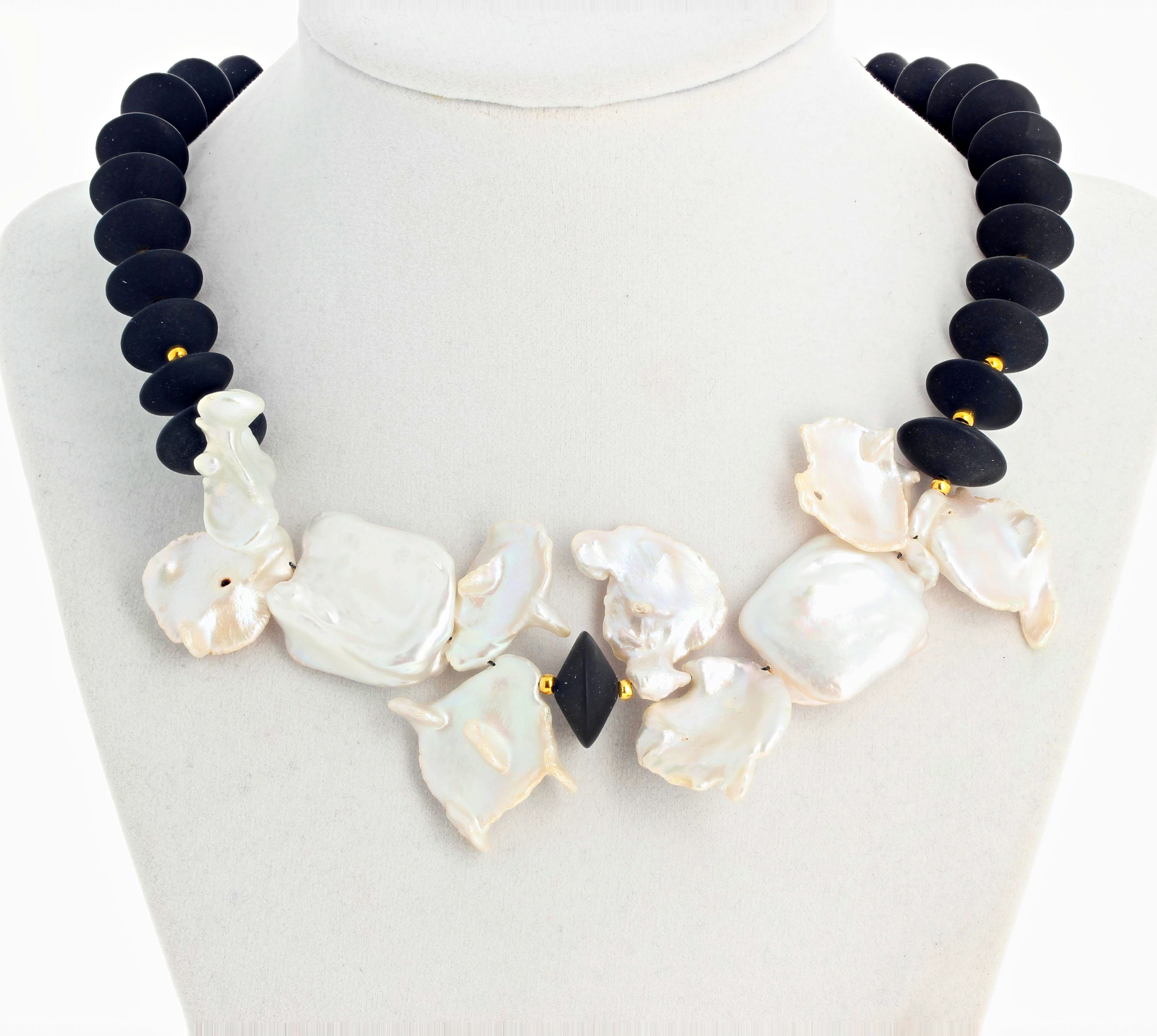 Beautiful flippy floppy white glistening natural cultured White Pearls (largest approximately 26 mm x 22 mm) set with beautiful rondels of natural black Onyx in this 17 inch long necklace with gold plated easy to use hook clasp.   If you wish faster