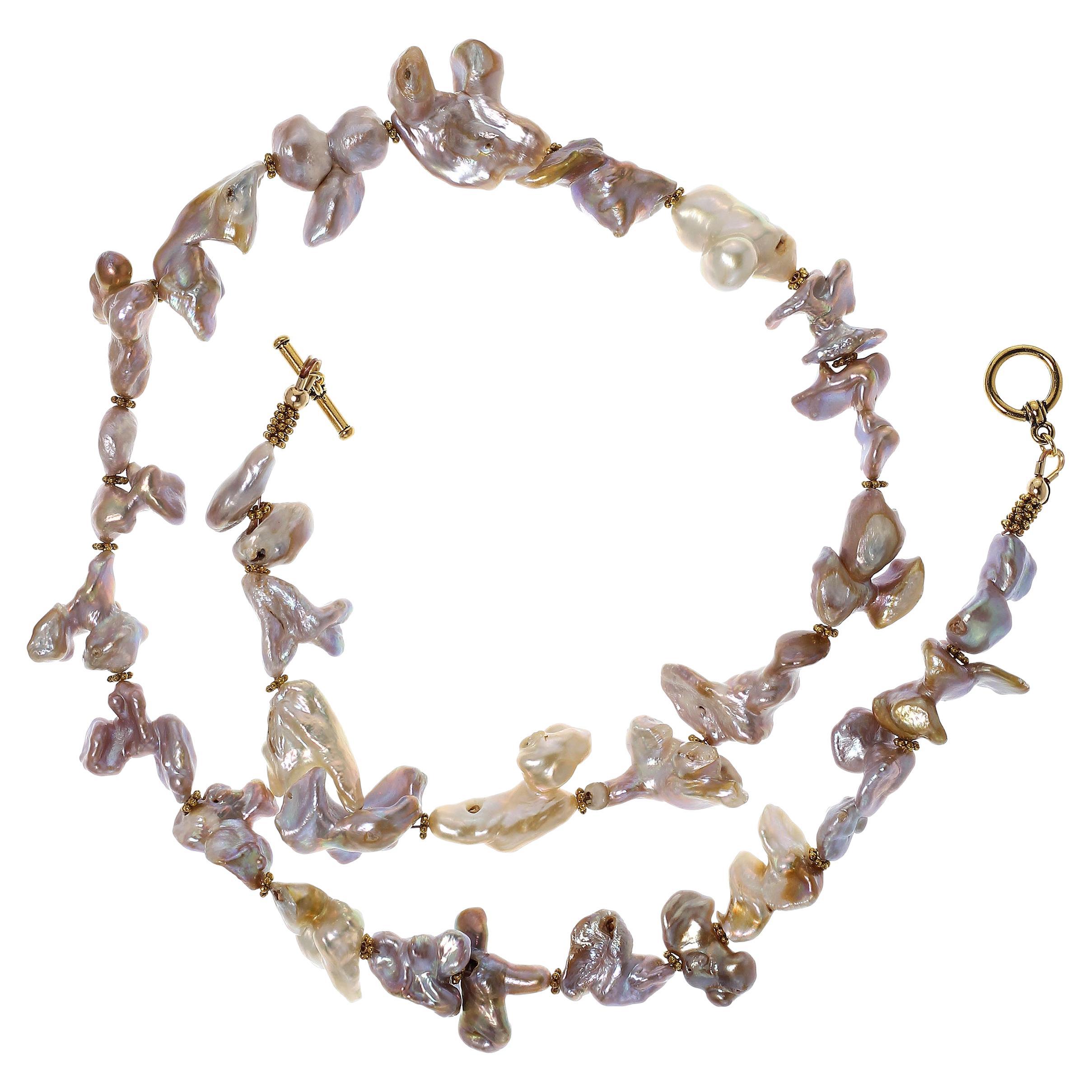 Own the pearls you deserve

This unique necklace is just the thing for anyone who loves beautiful unusually shaped pearls. They lovlies iridesce purple, pink, green, and a bit of yellow and some of them have beauty marks. We have accented these