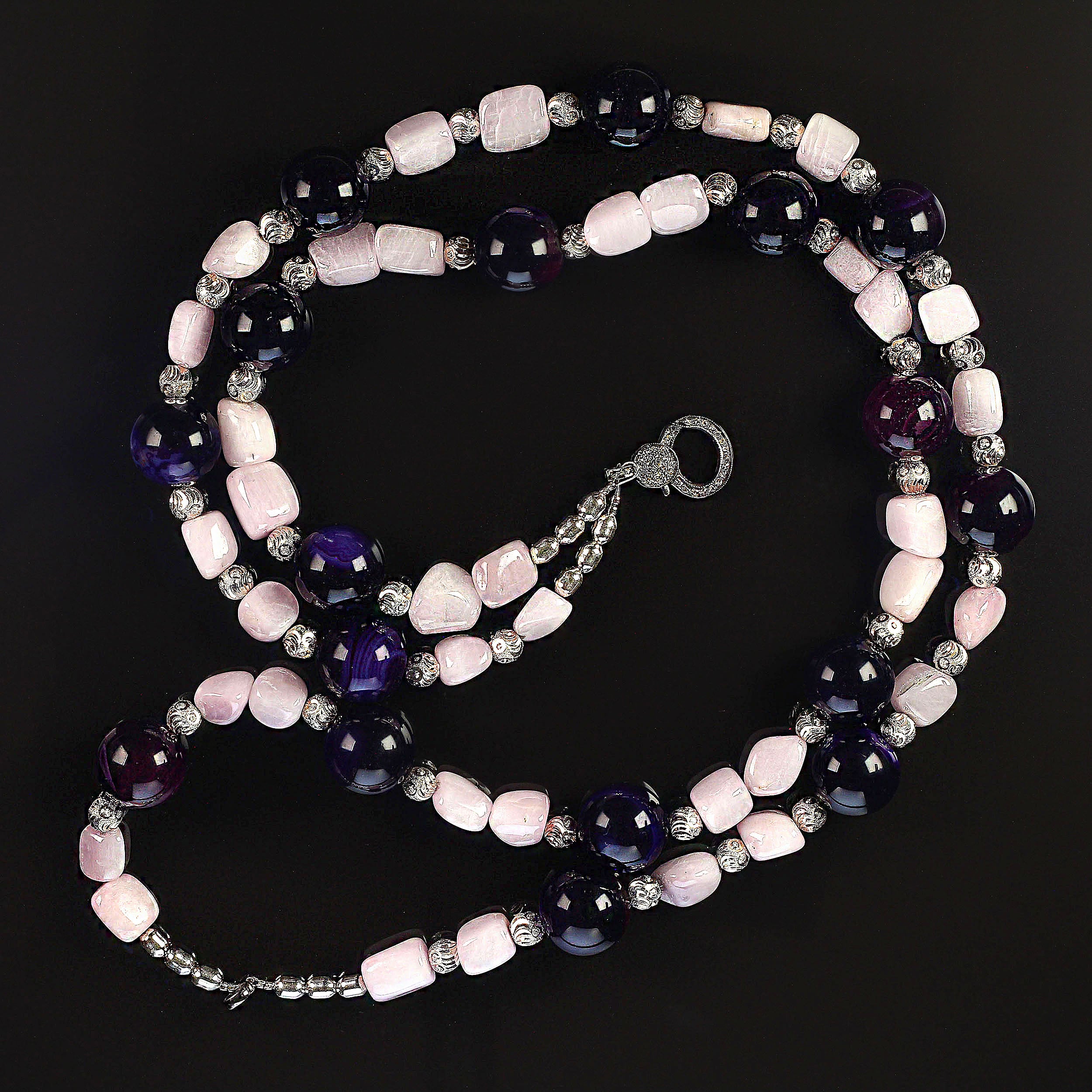 Light and dark elegant necklace of Amethyst spheres and Kunzite nuggets.  Wear this double strand necklace with all your winter wardrobe, at 20 inches it will sit nicely with most collars and necklines. These two strands will sit next to each other