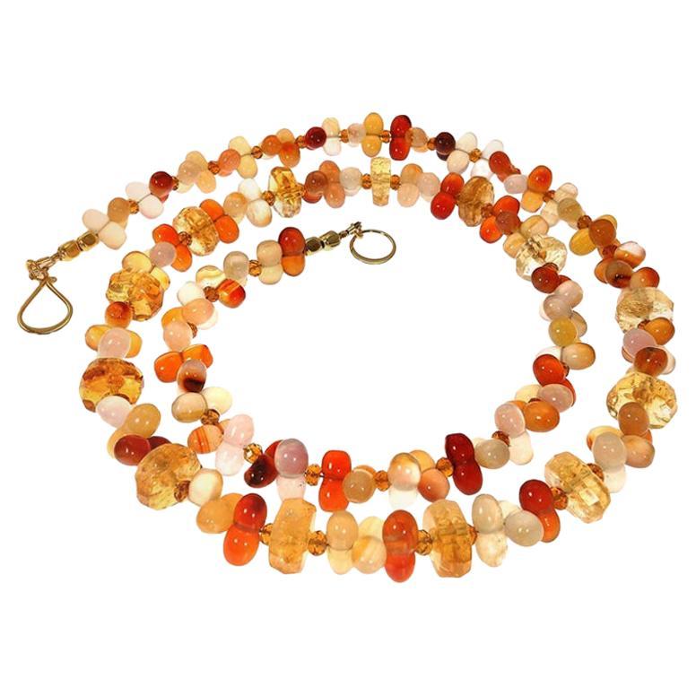 Unique necklace of Fall tones hourglass shaped Agate accented with rondelles of sparkling Citrine.  This handmade Gemjunky necklace is a feast for the eyes.  Created from 10 MM hour glassed shaped, multi colored Agates and accented across the front