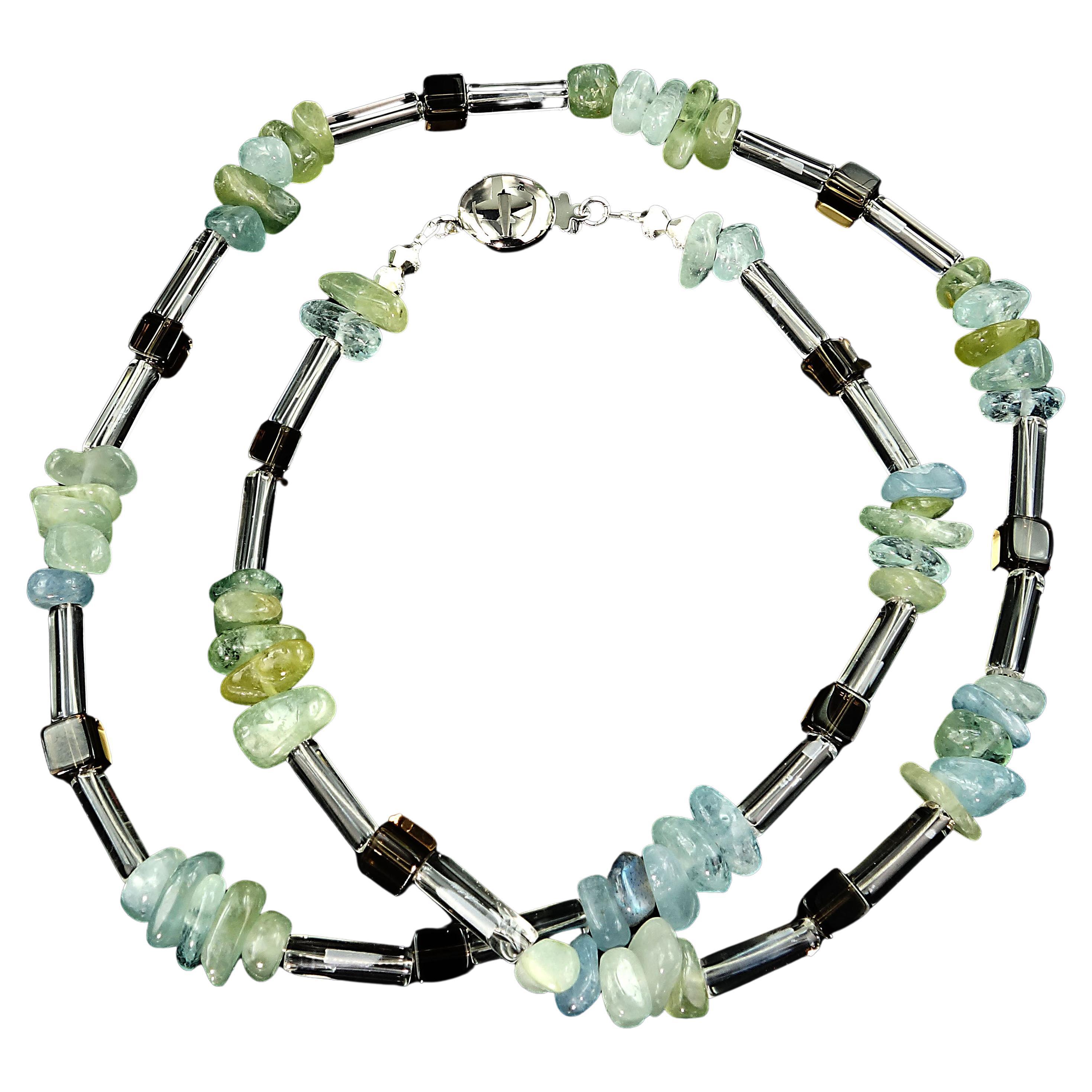 Versatile necklace of highly polished Aquamarine chips, transparent squares of Smoky Quartz and tubes of Crystal. These gorgeous nuggets of Aquamarine vary in color from light blue through deeper blue and into green.  The Smoky Quartz are clean and