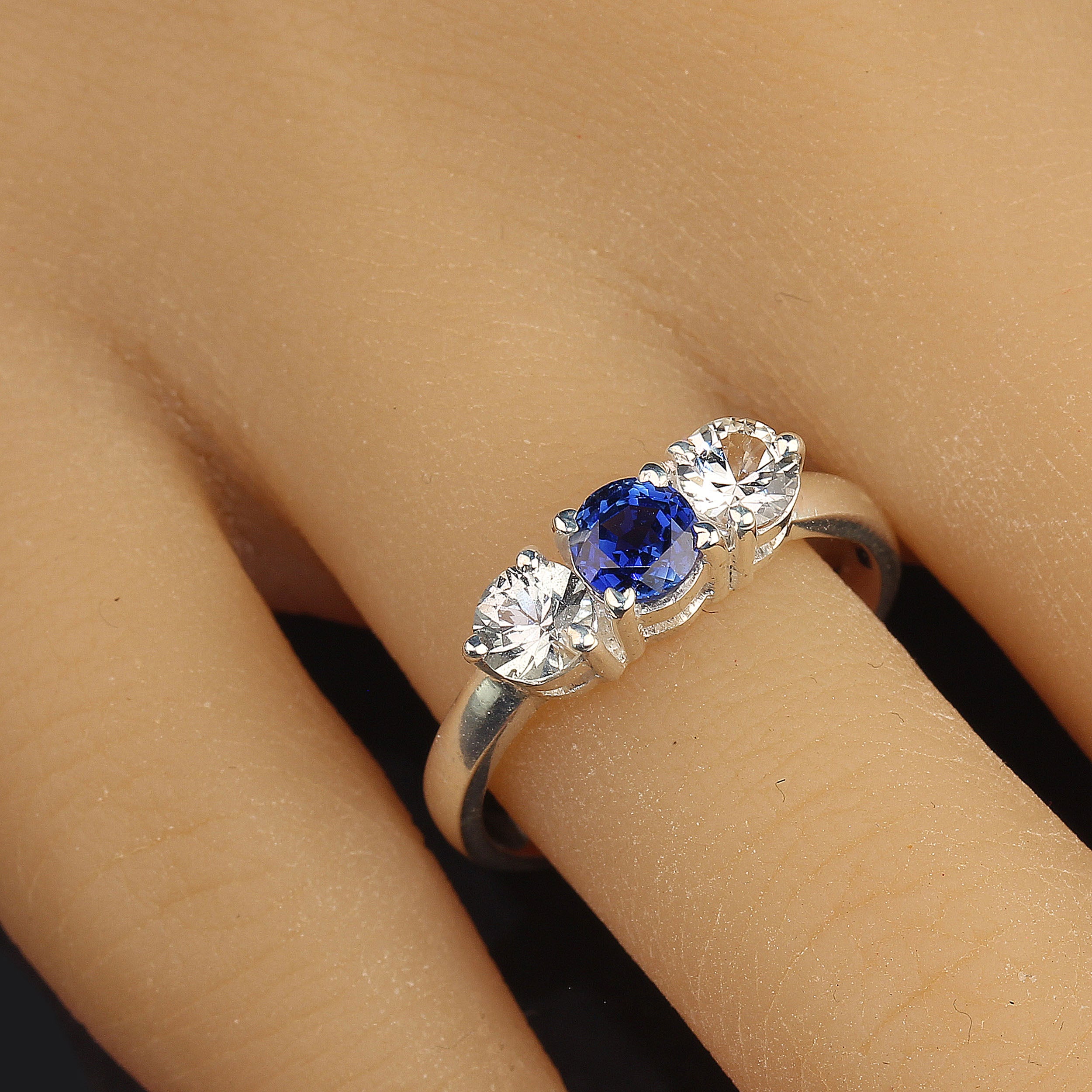 AJD Sparkling Classic Three-Stone Blue and White Sapphire Ring For Sale