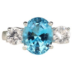 AJD Elegant Blue Topaz and Sparkling Cambodian Zircon Ring