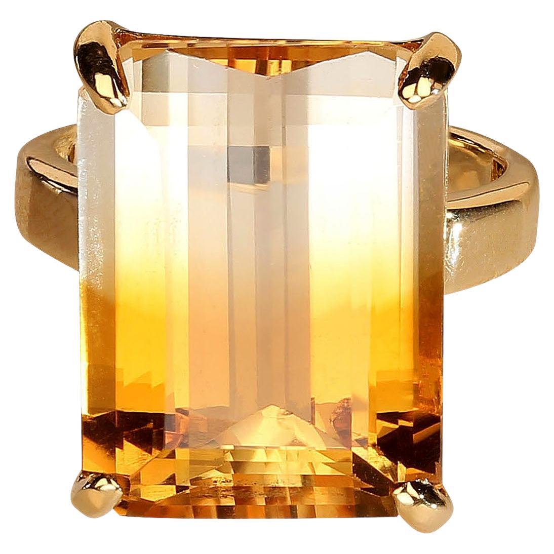 Bespoke Citrine and 18K yellow gold ring. This unique bi color Citrine is eye candy especially in the rich yellow 18K handmade setting. The large, 18x13mm, emerald cut is perfect. This gemstone sparkles and dances on your finger.  Its energy will