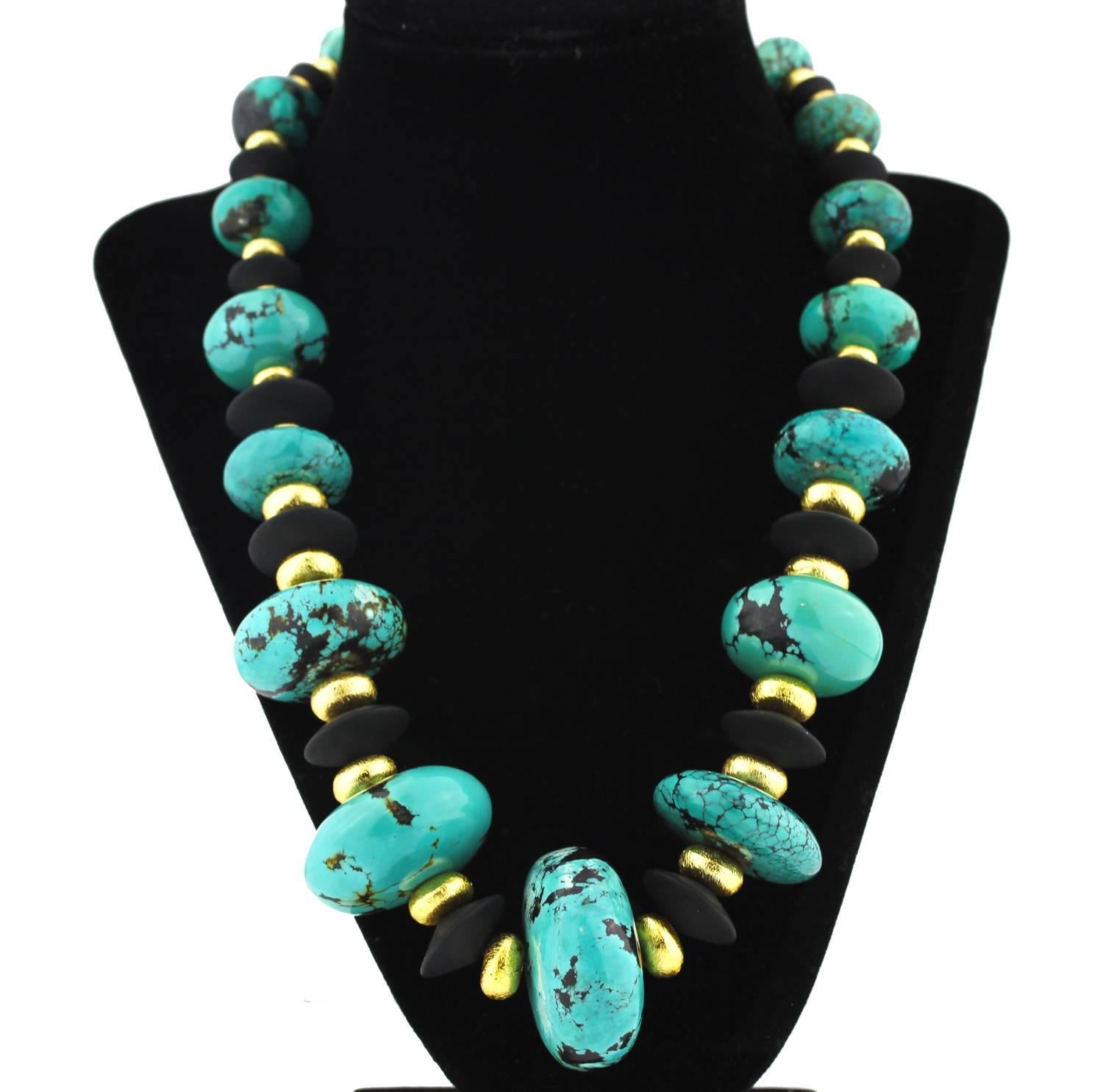 Gemjunky Splendid huge graduated natural blue Turquoise with black matrix necklace.   The Turquoise, largest is 38.8mm x 19mm, is enhanced by flat black Onyx and gold tone accents.   The necklace is a pleasing 21.5 inches in length and closes with a