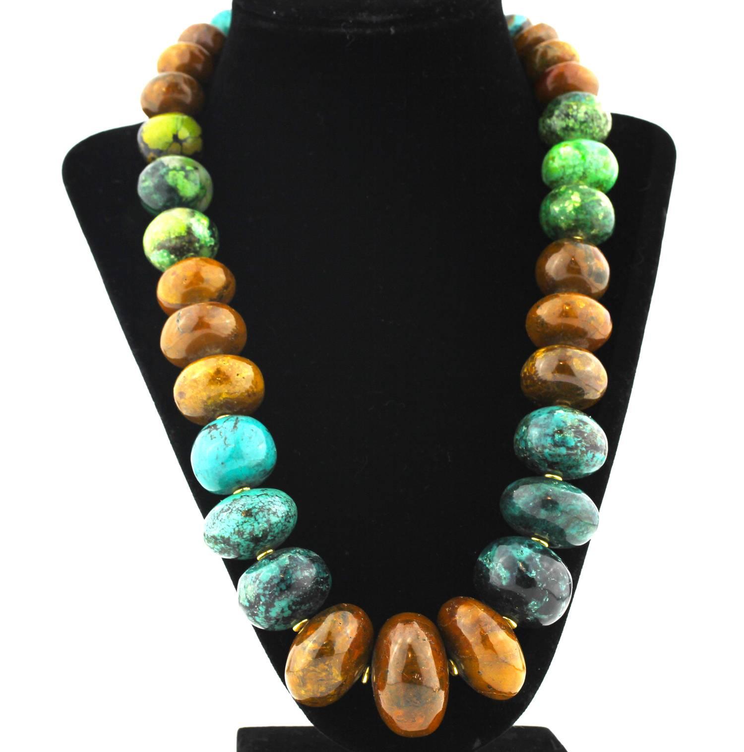Gemjunky Graduated highly polished magnificent colors of Natural Turquoise enhanced with small gold tone accents.  These colors were carefully hand selected to compliment one another. 
This is a unique handmade necklace..It's a lovely 22.5  inches