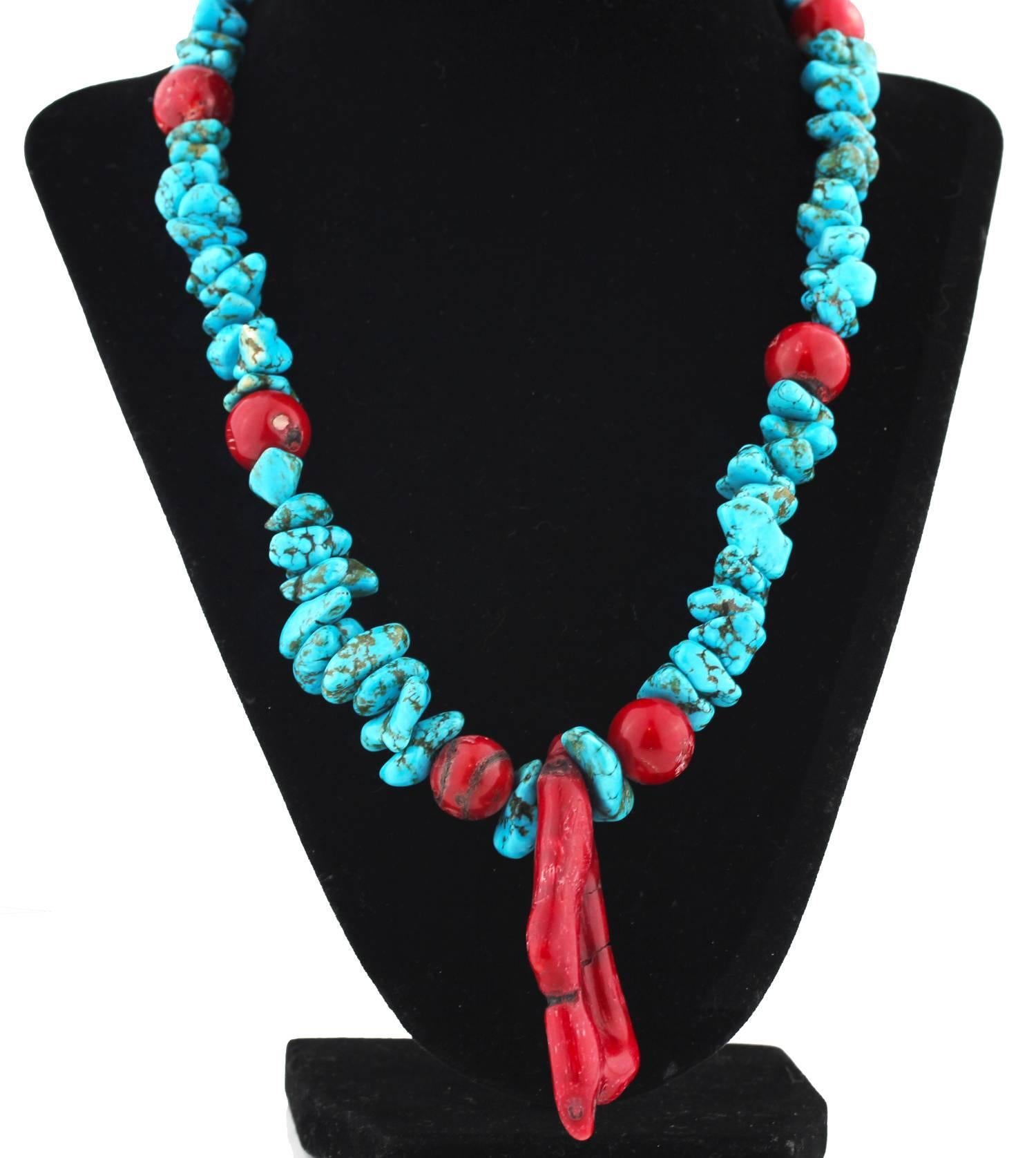 Drop necklace style Faux blue blue blue polished Turquoise enhanced with round red natural Bamboo Coral.  The 70mm natural red Coral drop makes a dramatic focal on this unique beautiful handmade necklace..  The necklace is a comfortable 19.5 inches