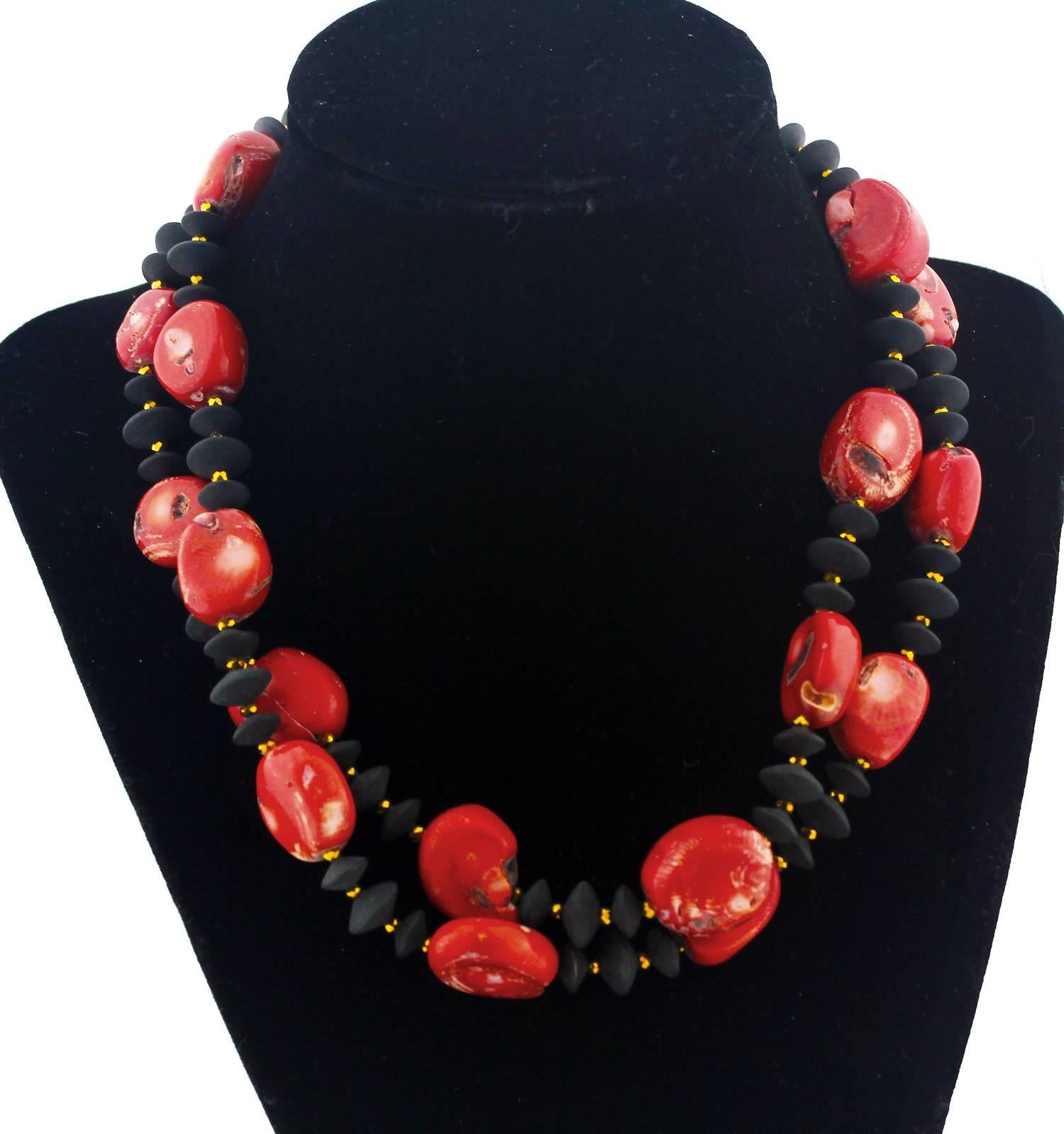 Splendid double strand of graduated unique Red Bamboo Coral.  It  is enhanced with natural flat black polished Onyx and goldy tone accents in this handmade necklace. It's almost choker length at 17inches, it's largest bit of coral is 20mm x 19mm and