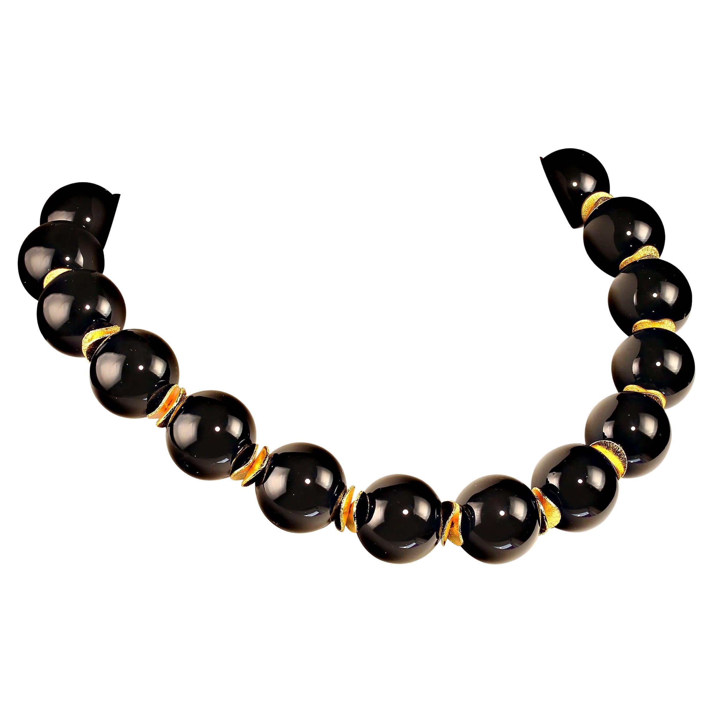 Striking Black Onyx Choker of highly polished 20MM spheres and gold tone flutter accents. The 17 inch Choker length necklace is secured with a vermeil toggle clasp.