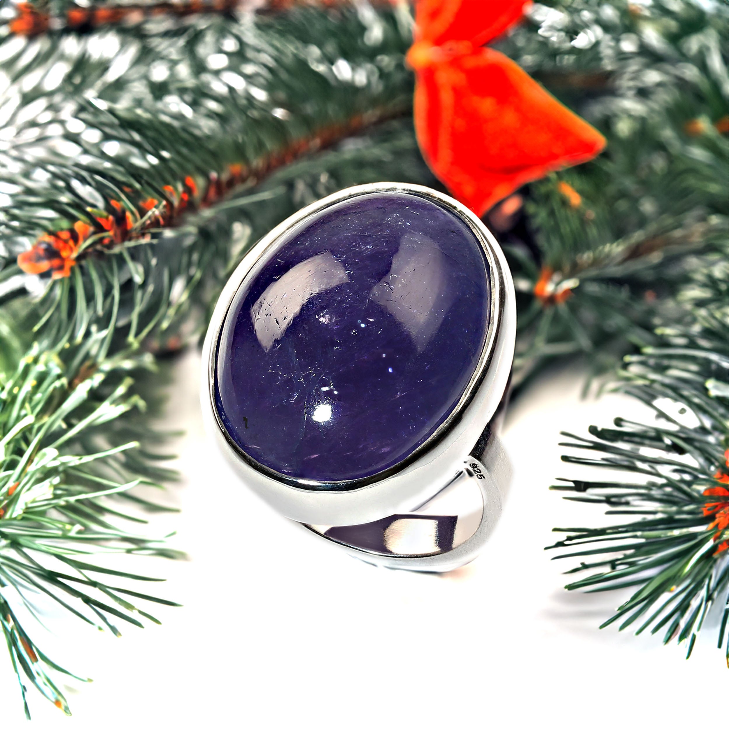 AJD Anello con cabochon ovale di tanzanite in argento sterling