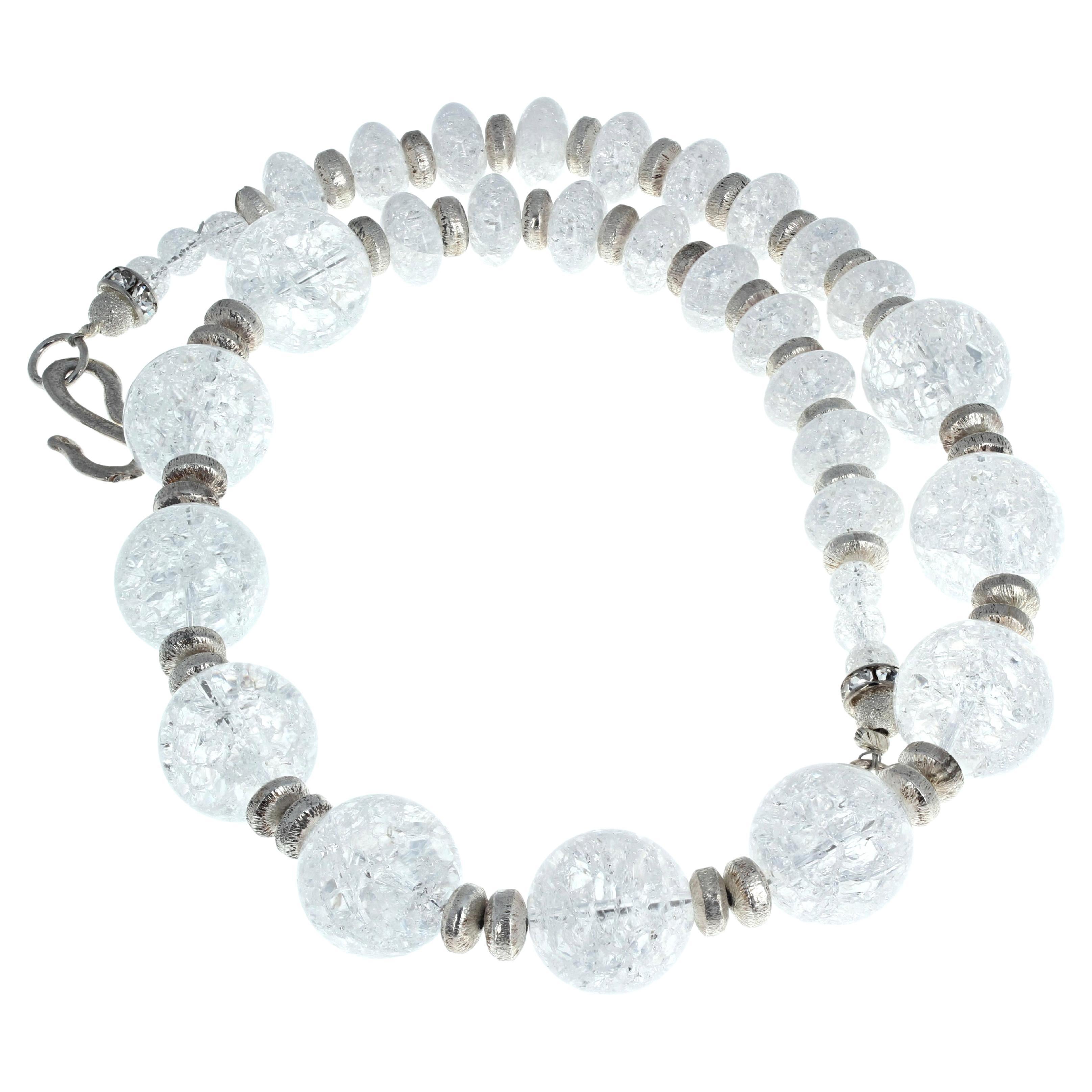 Fascinating beautiful elegant huge natural white Quartz 21 inch long necklace enhanced with lovely polished shining silver rondels.  The largest round Quartz are 18 1/2mm and the smaller ones are approximately 12 1/2 mm.  The clasp is a silver easy