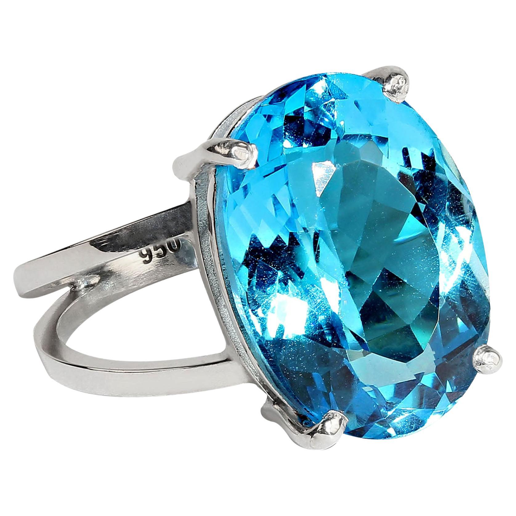 Sparkling Swiss Blue Topaz and handmade Sterling Silver ring.  This gorgeous ring comes from our favorite vendor in Belo Horizonte, Minas Gerais, Brazil. The 17.22CT Swiss Blue Topaz os 18 X 13 MM. The classic basket setting is handmade in 3.95grns
