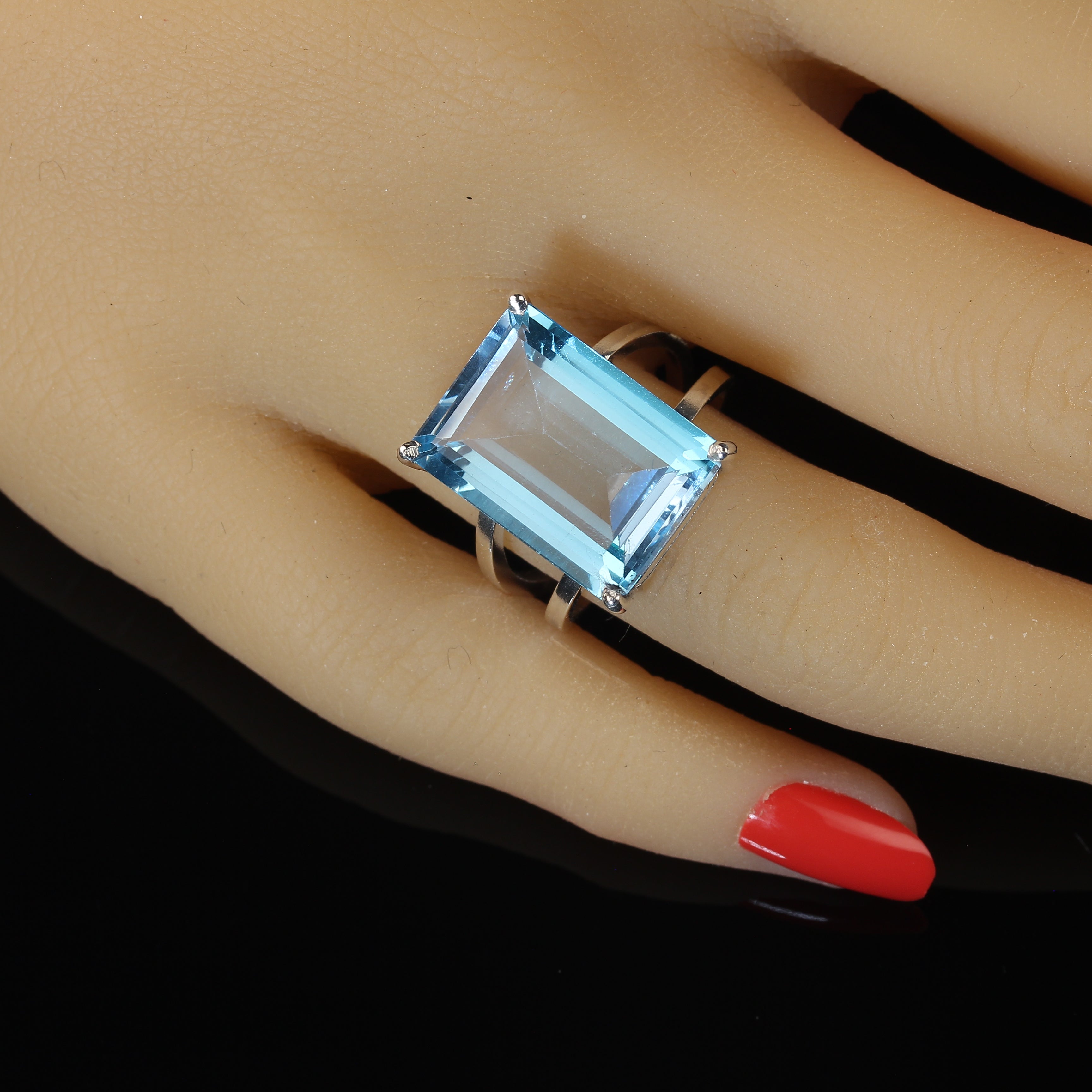 AJD Exciting 16 Carat Emerald Cut Sky Blue Topaz and Sterling Silver Ring For Sale