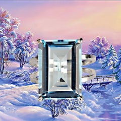 AJD Exciting 16 Carat Emerald Cut Sky Blue Topaz and Sterling Silver Ring