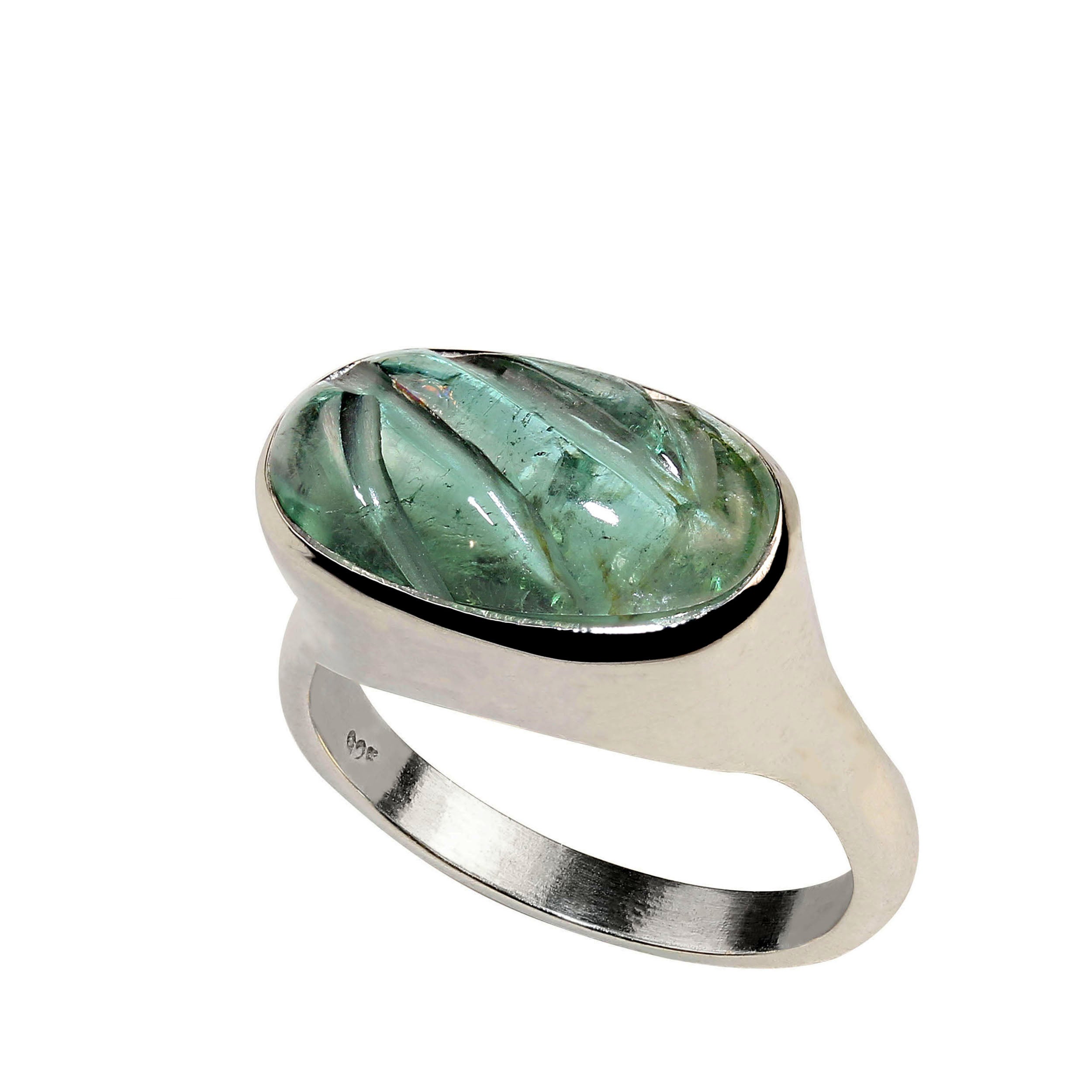 Exquisite Carved Green Tourmaline Ring in Custom Sterling Silver
Elevate your jewelry collection with this unique carved green tourmaline ring, set in a beautifully crafted custom-made Sterling Silver design. The stunning east-west bezel setting