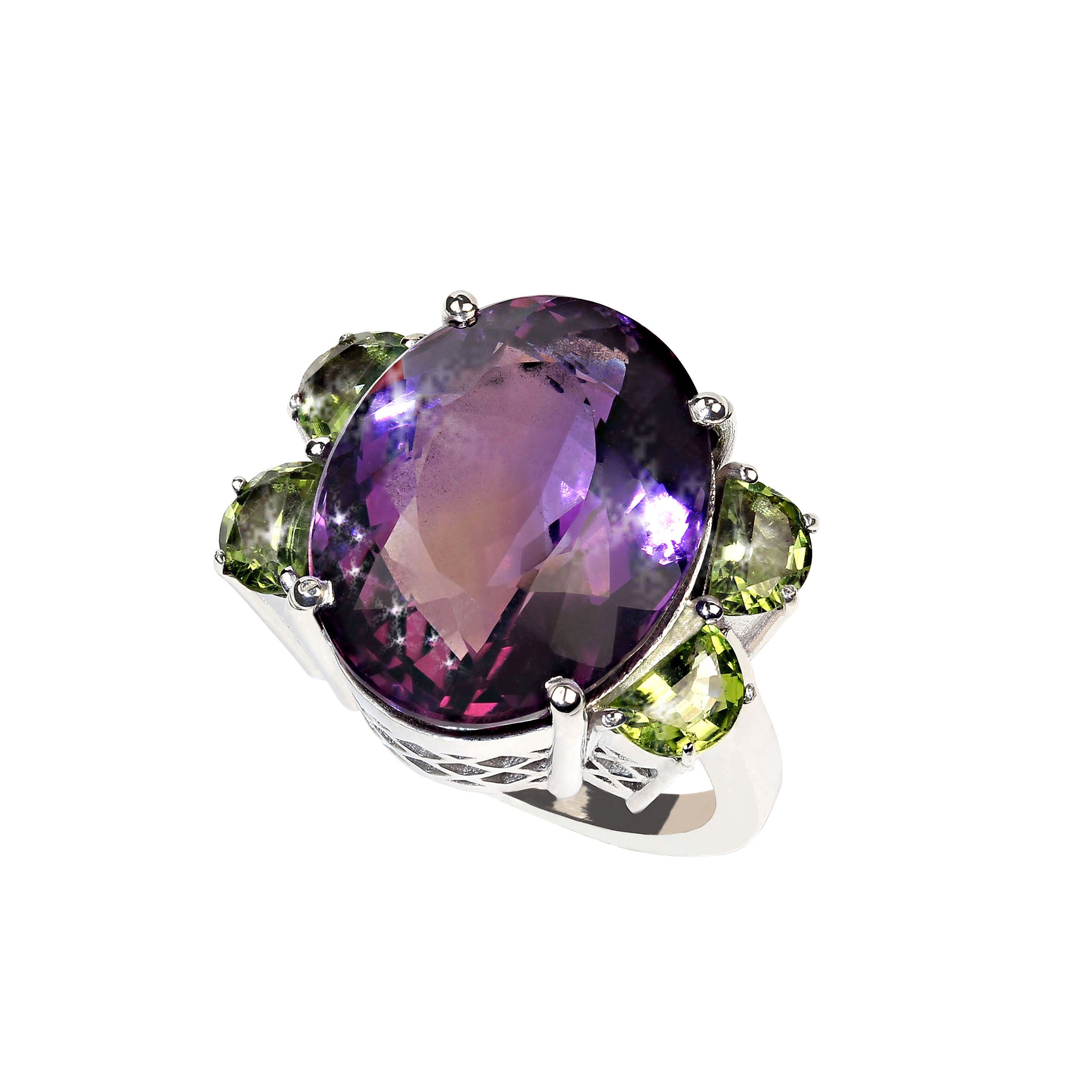 Awesomely elegant dinner ring of Amethyst and Peridot. This sizable 8 ring is a sparkling 20.58 carat oval Amethyst and four perfect Peridot to accent it, 2.06cwt. These gorgeous gemstones are in a custom Sterling Silver setting. Amethyst is the