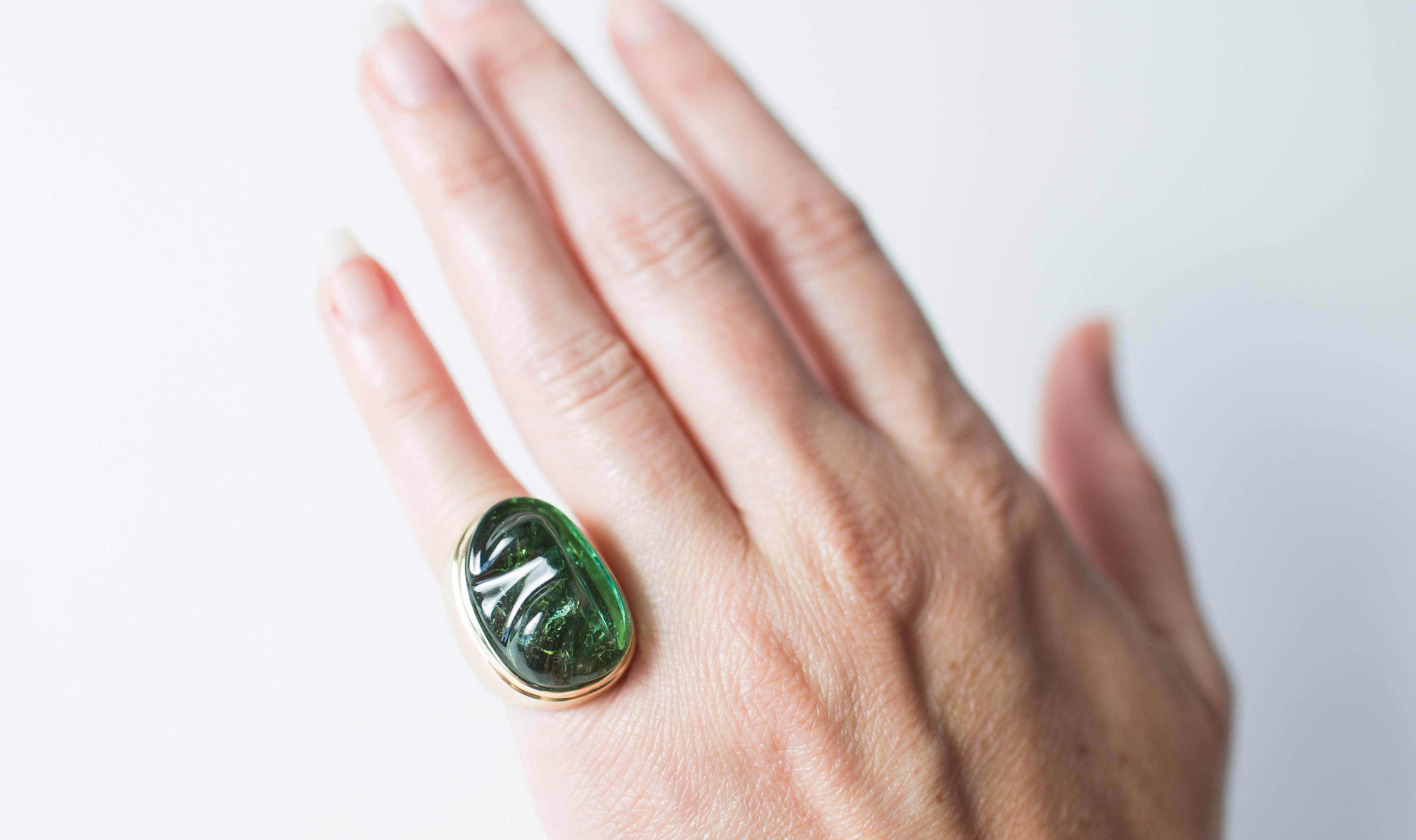 Beautiful  Sculpted Green Tourmaline and 18Kt Yellow Gold Ring by world renowned Brazilian jeweler Haroldo Burle Marx (1911-1991).  The Green Tourmaline is bezel set in brushed 18Kt Yellow Gold.  The Sculpted Green Tourmaline is reminiscent of