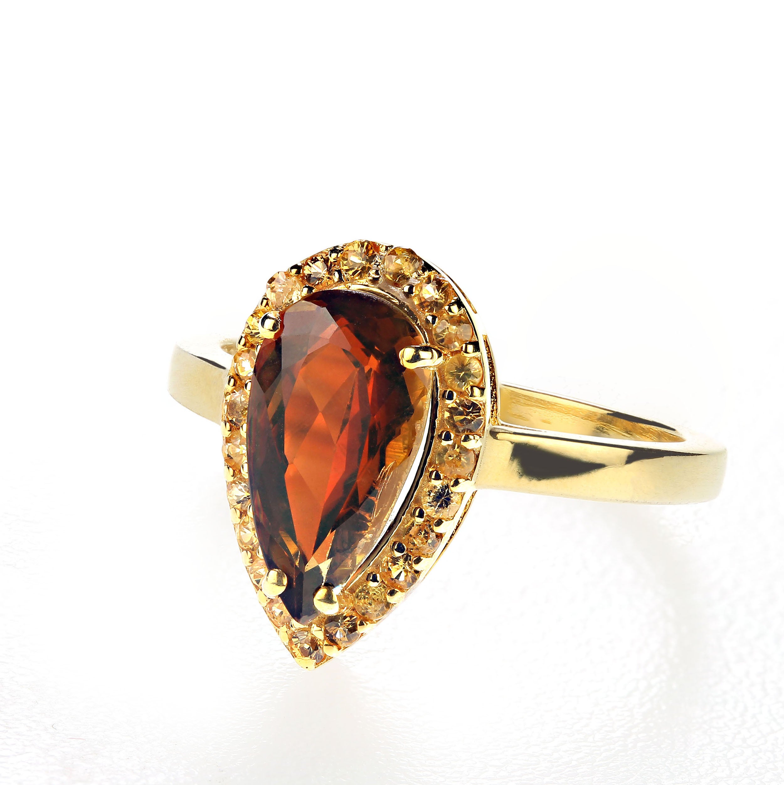 Rare Andalusite long drop custom set with yellow Sapphires in a gold over Sterling Silver ring.  This 2.73 carat gemstone is pleochroic which means that it shows different colors depending on the angle from which it is viewed. Gemstones with special